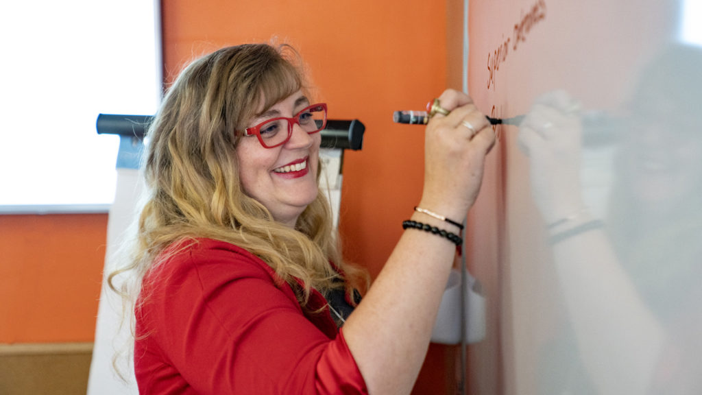 Rhea writing on white board